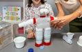 Recycled toy robot with plastic packages in ecology classroom - PhotoDune Item for Sale
