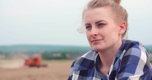 Agriculture - Female Farmer Looking at Crops During Harvesting