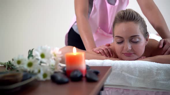 Woman Gets Back Massage Spa By Massage Therapist