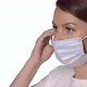 Young Caucasian Beautiful Woman Put on Protective Face Mask - VideoHive Item for Sale
