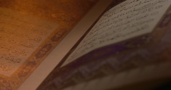 Holy Quran On Book Rest With Prayer Beads