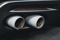 rear view of black sport car pair of exhaust pipes - PhotoDune Item for Sale