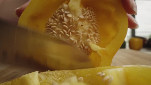 Zoom out macro video of cut yellow pepper. Shot with RED helium camera in 8K