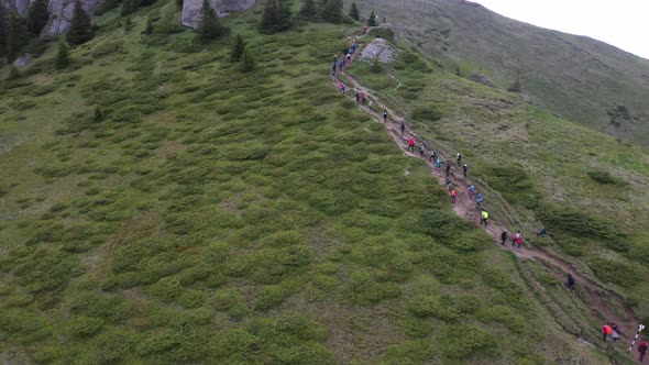 Group Of People On A Mountain Trail At High Altitude