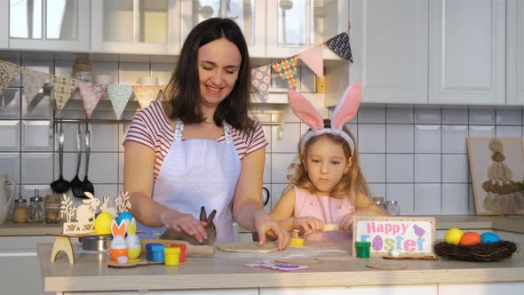 Family Making Cookies with Cute Easter Bunny