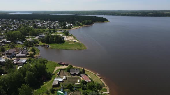 Aerial View of Coastal Town on Sunny Summer Day Near River