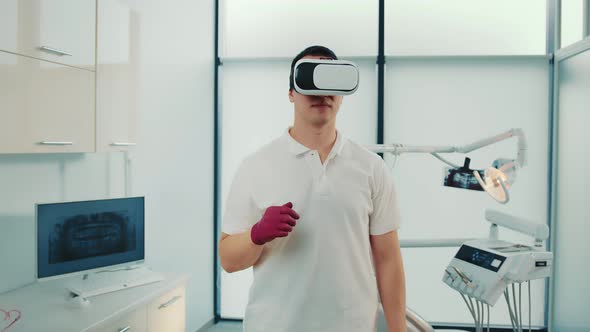 Closeup of Multiracial Doctor in Virtual Reality Glasses Speaking Something and Gesturing in Modern