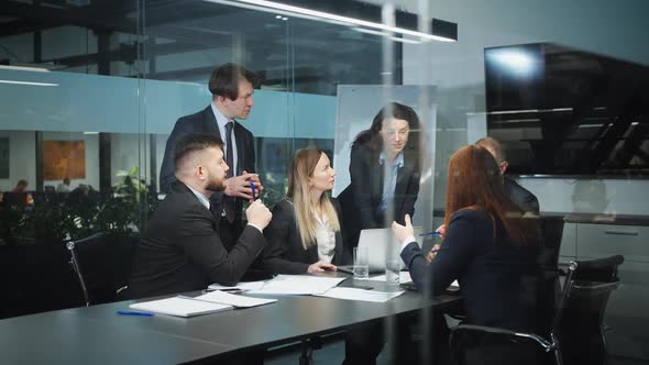 Business Team Meeting in Office to Discuss Strategy