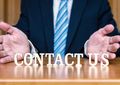 CONTACT US letters between hands and desk - PhotoDune Item for Sale