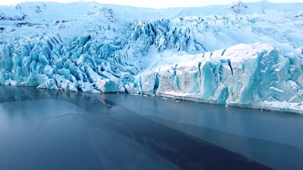 Glacier in Iceland Huge Chunks of Blue Ice Arctic Landscape with New Icebergs Aerial View Global