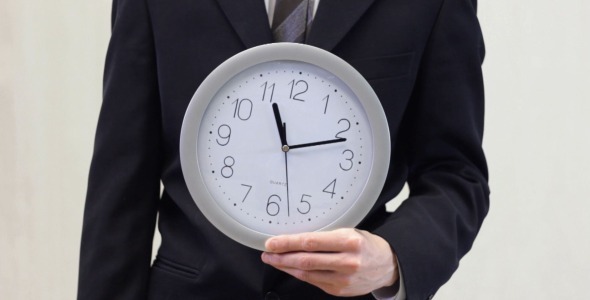 Businessman Shows Time on Clock (white)