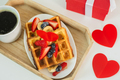 Top view on breakfast for valentines Day. Wooden tray with  waffle and cup of coffee, red gift box - PhotoDune Item for Sale