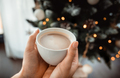 Cup of coffee with christmas tree in background - PhotoDune Item for Sale