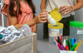 Girl recycling plastic with her teacher in an ecology classroom - PhotoDune Item for Sale