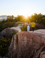 Couple watching sunset at Pai Canyon during sunset in Pai Mae Hong Son Northern Thailand - PhotoDune Item for Sale