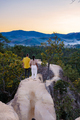 Couple watching sunset at Pai Canyon during sunset in Pai Mae Hong Son Northern Thailand - PhotoDune Item for Sale