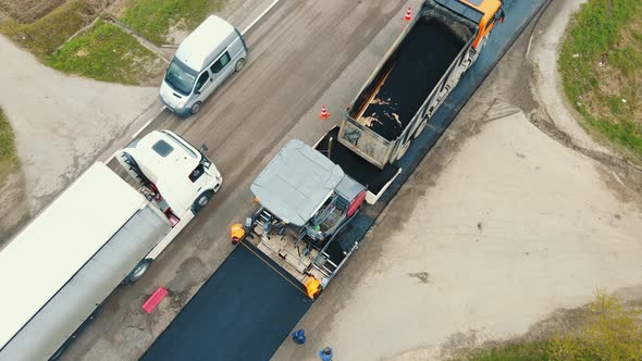 Aerial View Road Service Lays Asphalt on the Road