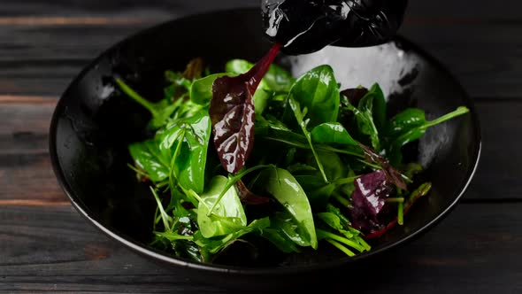 salad with arugula, spinach, olive oil. healthy lifestyle concept