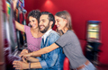 Happy young friends having fun together with slot machine - PhotoDune Item for Sale