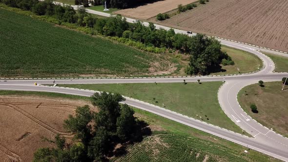 Aerial View of Highway Road Between Meadow and Agricultural Field