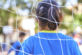 football goal net on a children soccer match  - PhotoDune Item for Sale