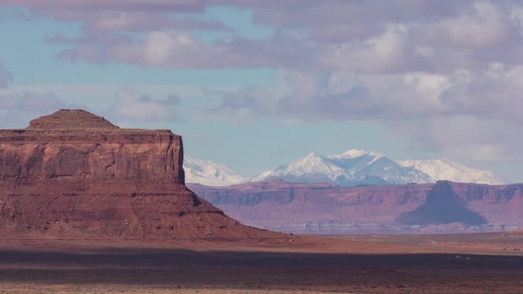 Monument Valley, Utah and Snowy Mountain Cloudscape Day