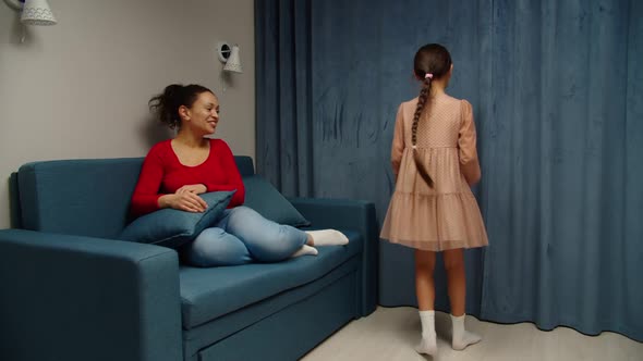 Preteen Girl Doing Gymnastic Exercise Showing Sport Achievement to Mom