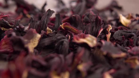 Dry hibiscus flowers. Dried red plant petalsHerbal wellness tea concept. Rotation. Macr