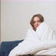 Woman Wrapped in White Blanket Spreads Her Arms Throws Off the Blanket and Smiles - VideoHive Item for Sale