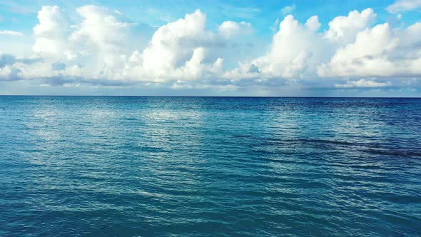 Natural Aerial Clean View of A White Sand Paradise Beach and Blue Sea Background