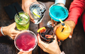 Top view of people hands toasting multicolored fancy drinks - PhotoDune Item for Sale