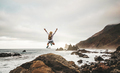 Happy man with backpack jumping on nature background  - PhotoDune Item for Sale