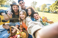 Friends group taking selfie portrait picture with smartphone on grass meadow - PhotoDune Item for Sale