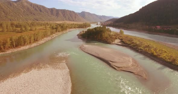 Low Altitude Flight Over Fresh Fast Mountain River with Rocks at Sunny Summer Morning