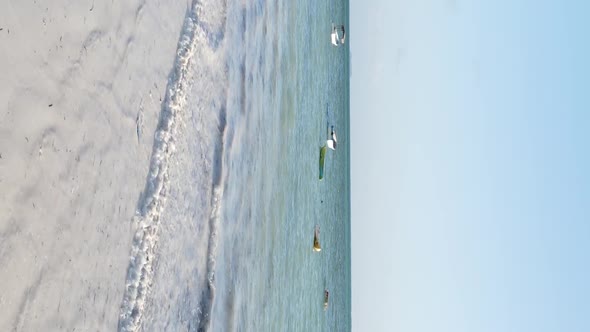 Tanzania Vertical Video  Boat Boats in the Ocean Near the Coast of Zanzibar Aerial View