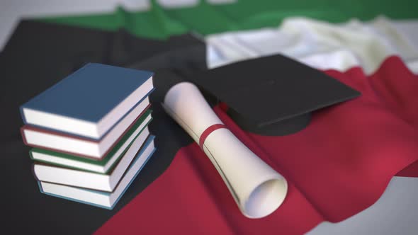 Graduation Cap and Diploma on Flag of Kuwait alt