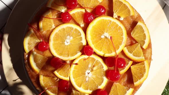 pie with oranges for a event day on picnic checked cloth