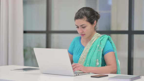 Indian Woman Working on Laptop in Office