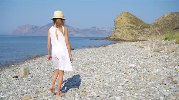 Cute Little Girl at Beach During Summer Vacation