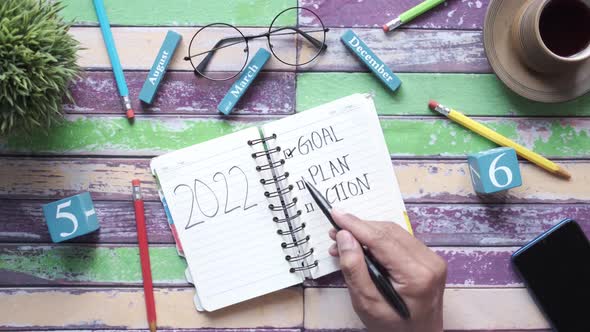2022 New Year Goals on Notepad on Table