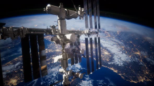 A View of the Earth and a Spaceship. ISS Is Orbiting the Earth