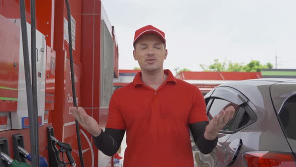 A Caucasian man, people, worker talking on webcam video call conference, filling up fuel