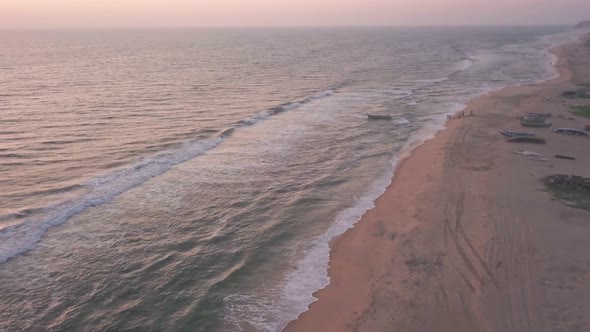 The Stunning Scenery Of The Waves Crashing On The Shore In Varkala, India During Golden Hours - Aeri