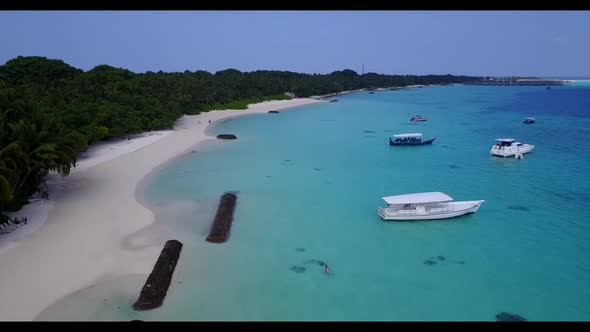 Aerial top down scenery of relaxing lagoon beach time by turquoise water with white sandy background