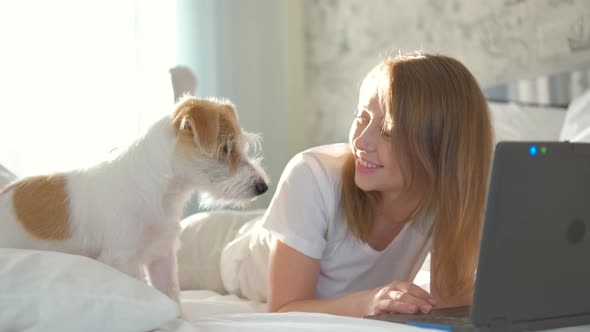 Portrait of a girl in casual clothes with a laptop.