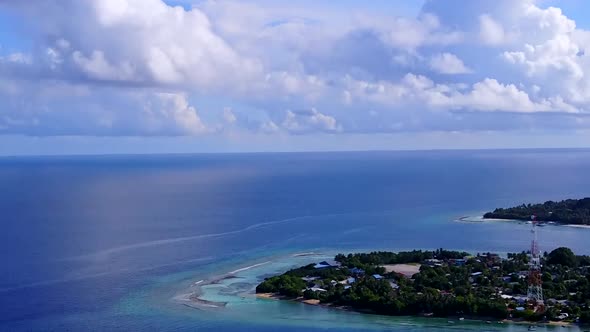 Aerial drone panorama of island beach by blue lagoon with sand background