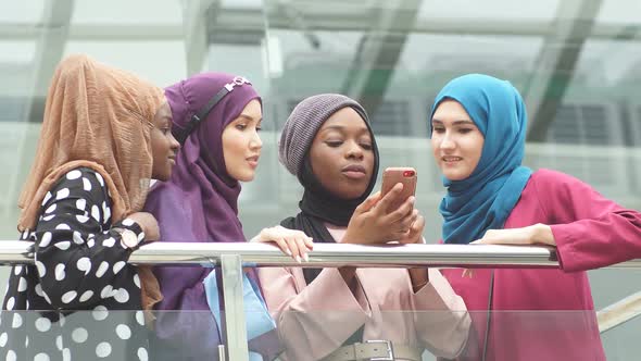 Islamic Female Travel Blogger Sharing Info From Smartphone with Her Followers