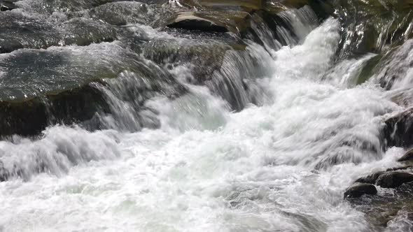 Clean Foamy Water of Mountain River Close Up