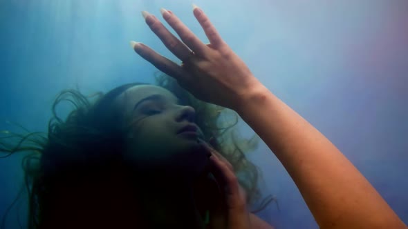 Lady in Deep Underwater Portrait of Pretty Woman with Swaying Hair in Water Dive and Drown