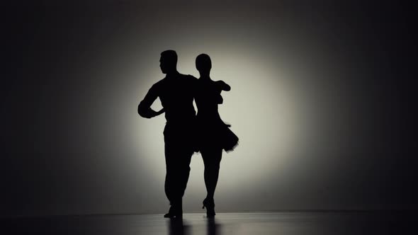 Passionate Tango Choreography Elements Performed By Pair of Ballroom Dancers